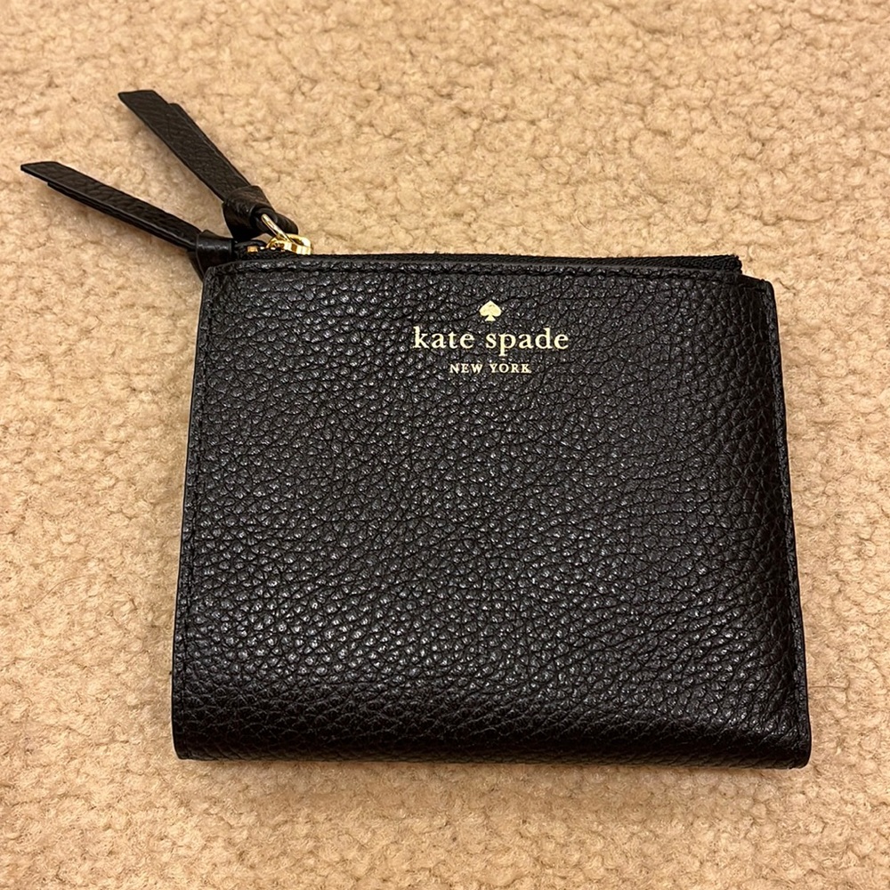 Kate spade black leather wallet with tons of room for cards and cash.